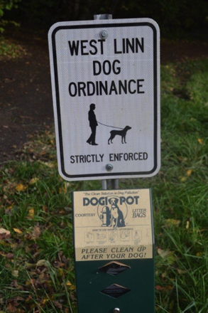 Dog rules and disposal bags at off-leash area